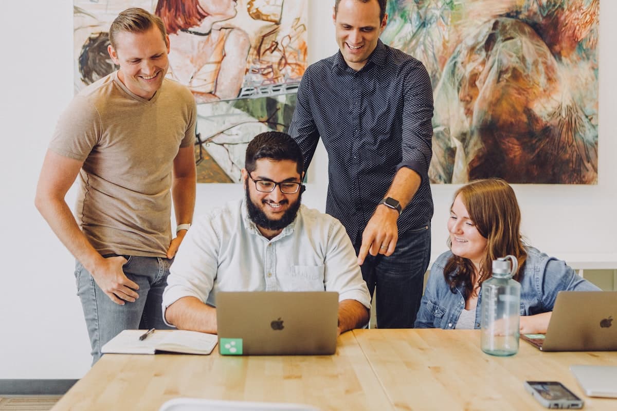 Travel agency team reviewing bookings together