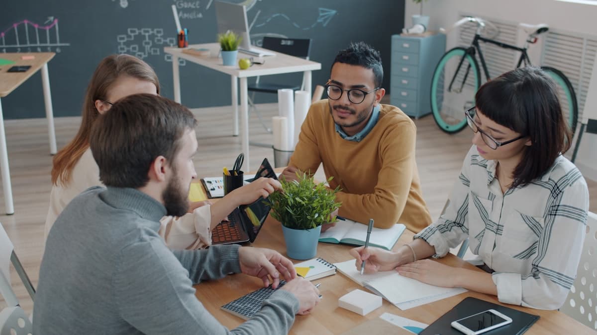 Travel agency team working at their desks